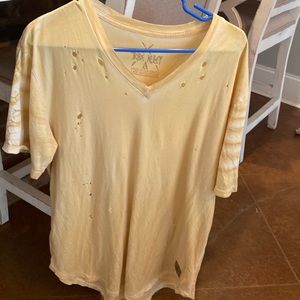 Men’s pale yellow V neck distressed shirt. Tribe Kelly. Size large